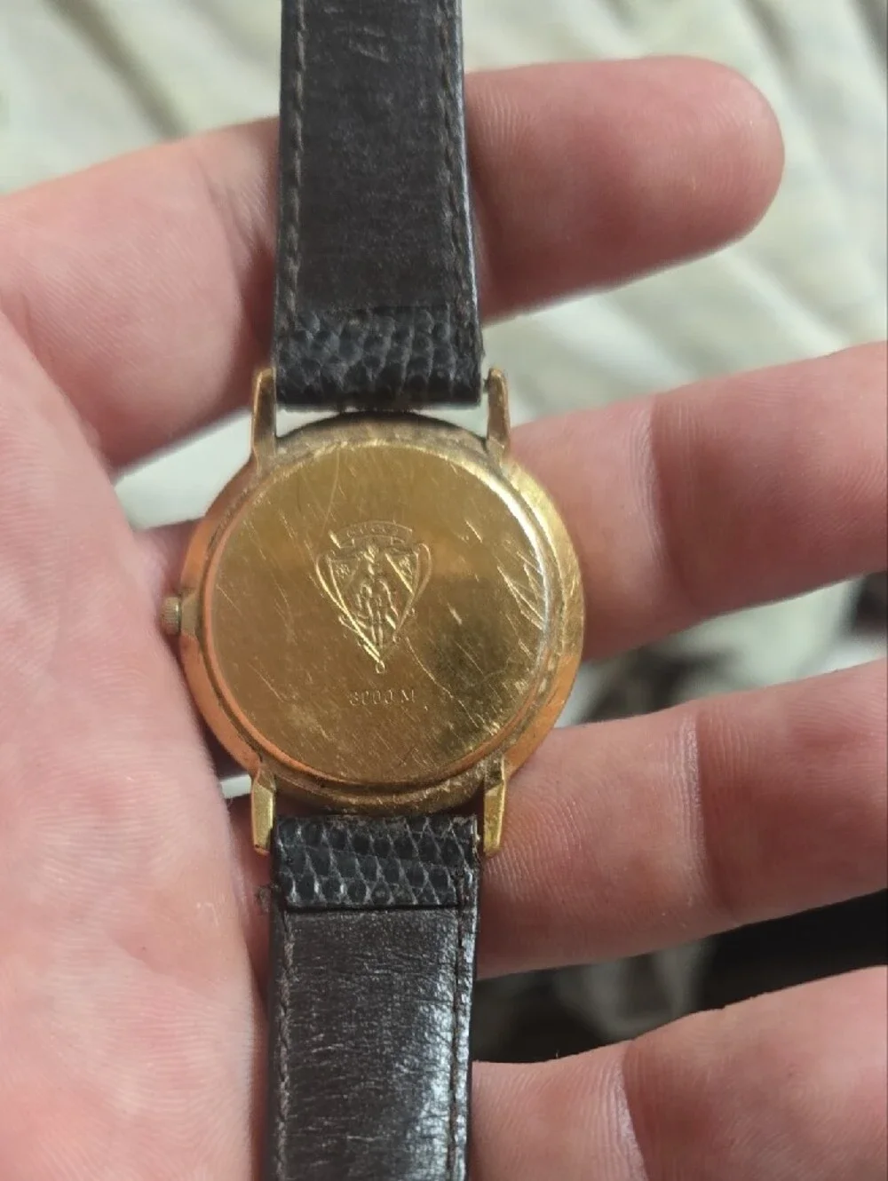 Gucci Gold-Tone Watch with Black Dial and Red Stripe